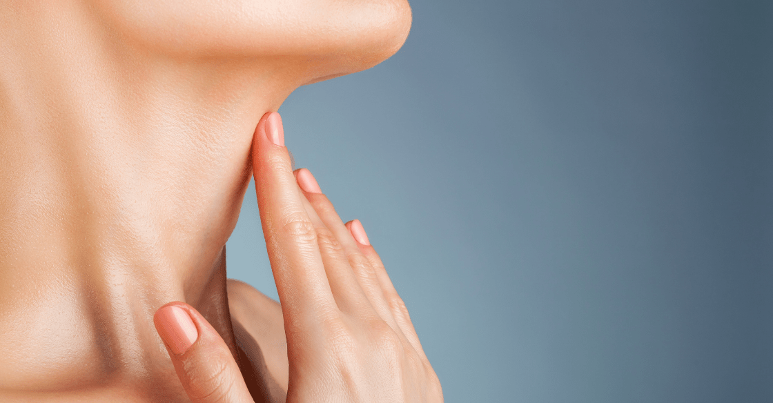 Woman touching her neck