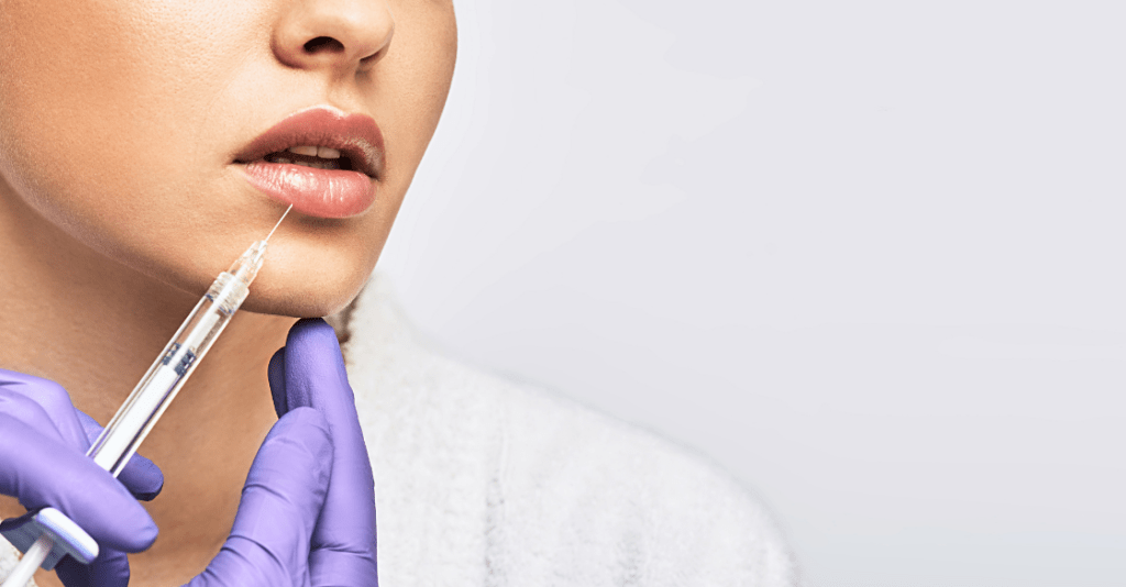 Woman getting dermal filler lip injections