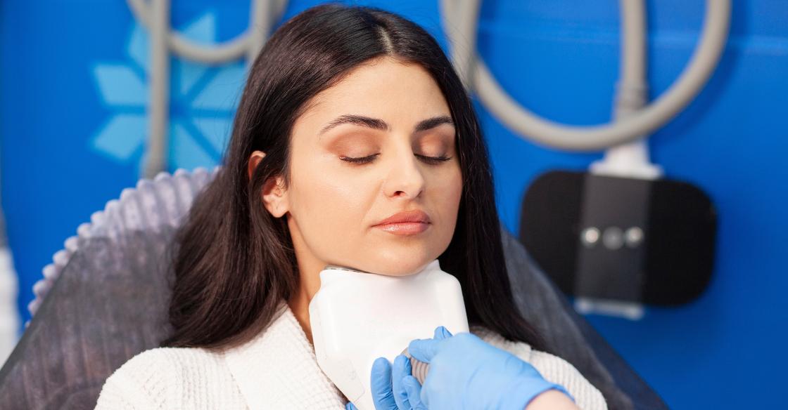Person receiving CoolSculpting for double chin in an office