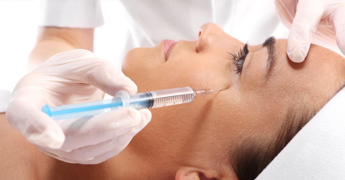 Person receiving Botox for crow's feet treatment from a plastic surgeon